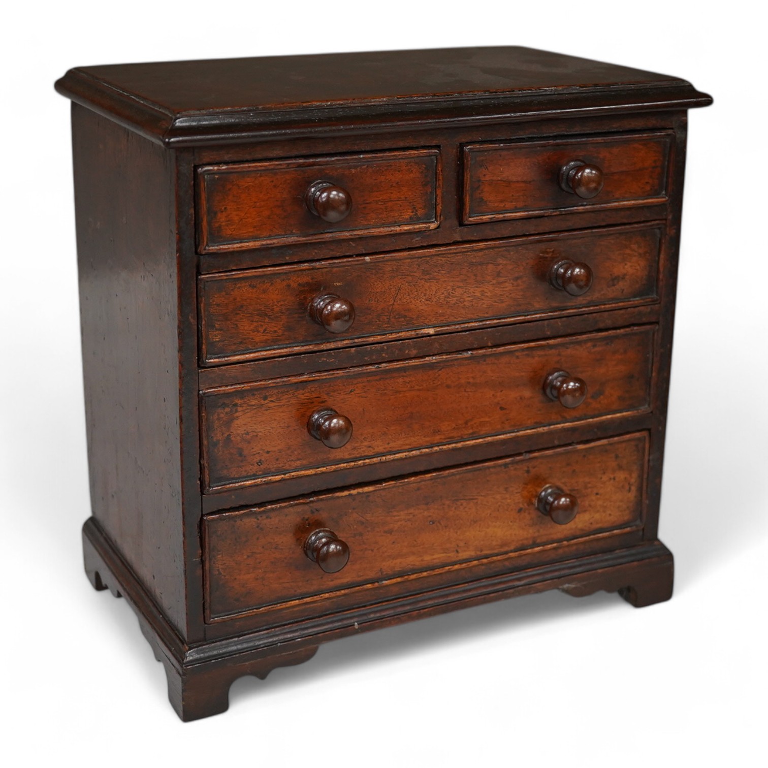 A 19th century miniature mahogany chest of five drawers, 28cm high. Condition - fair to good